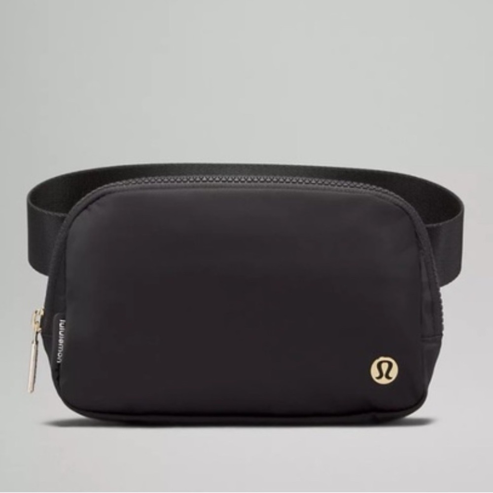 NWT lululemon Everywhere Belt Bag, black and gold with black plastic buckle